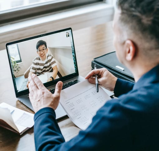 man on a video call with his student