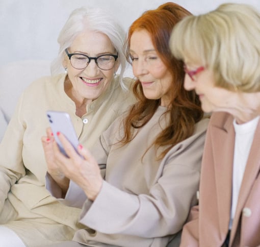 three grandwomen talking to each other